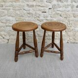Pair of solid wood tripod stools, carved.