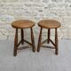 Pair of solid wood tripod stools, carved.