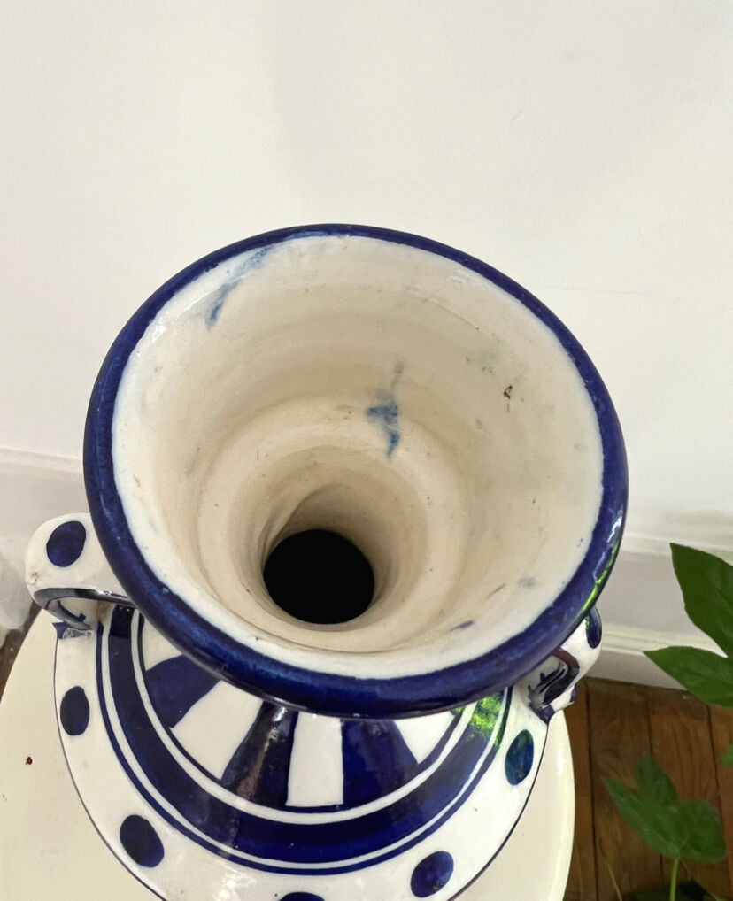 white amphora-style vase with hand-painted blue patterns