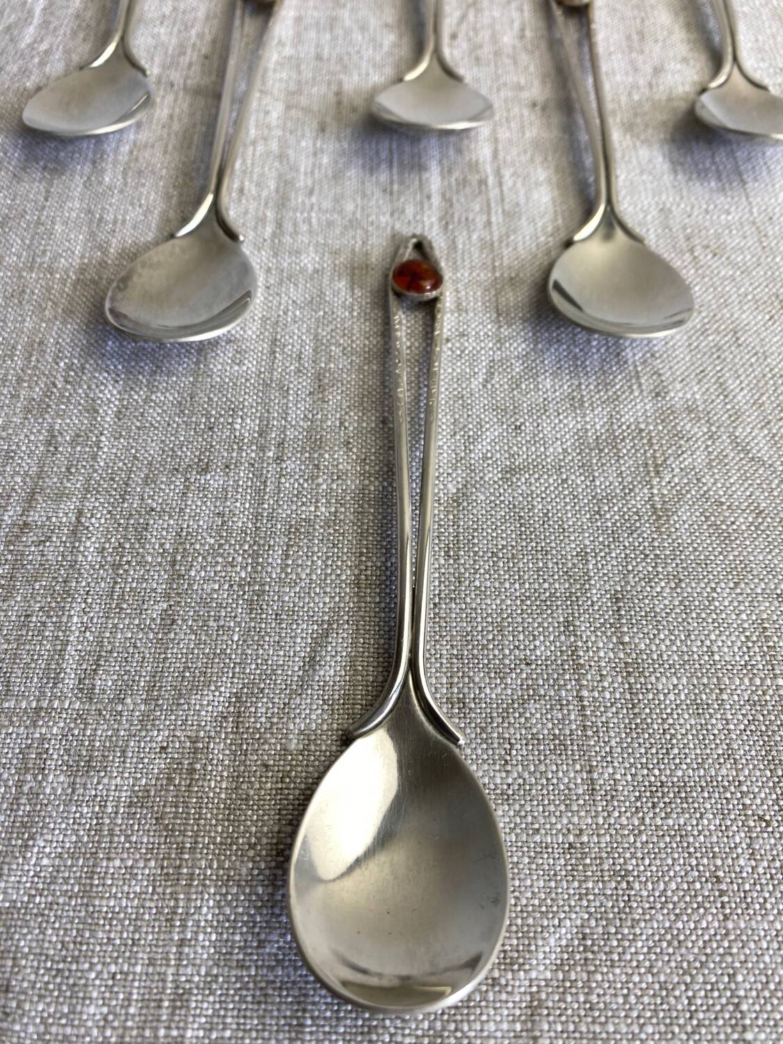Art Nouveau metal and amber spoons