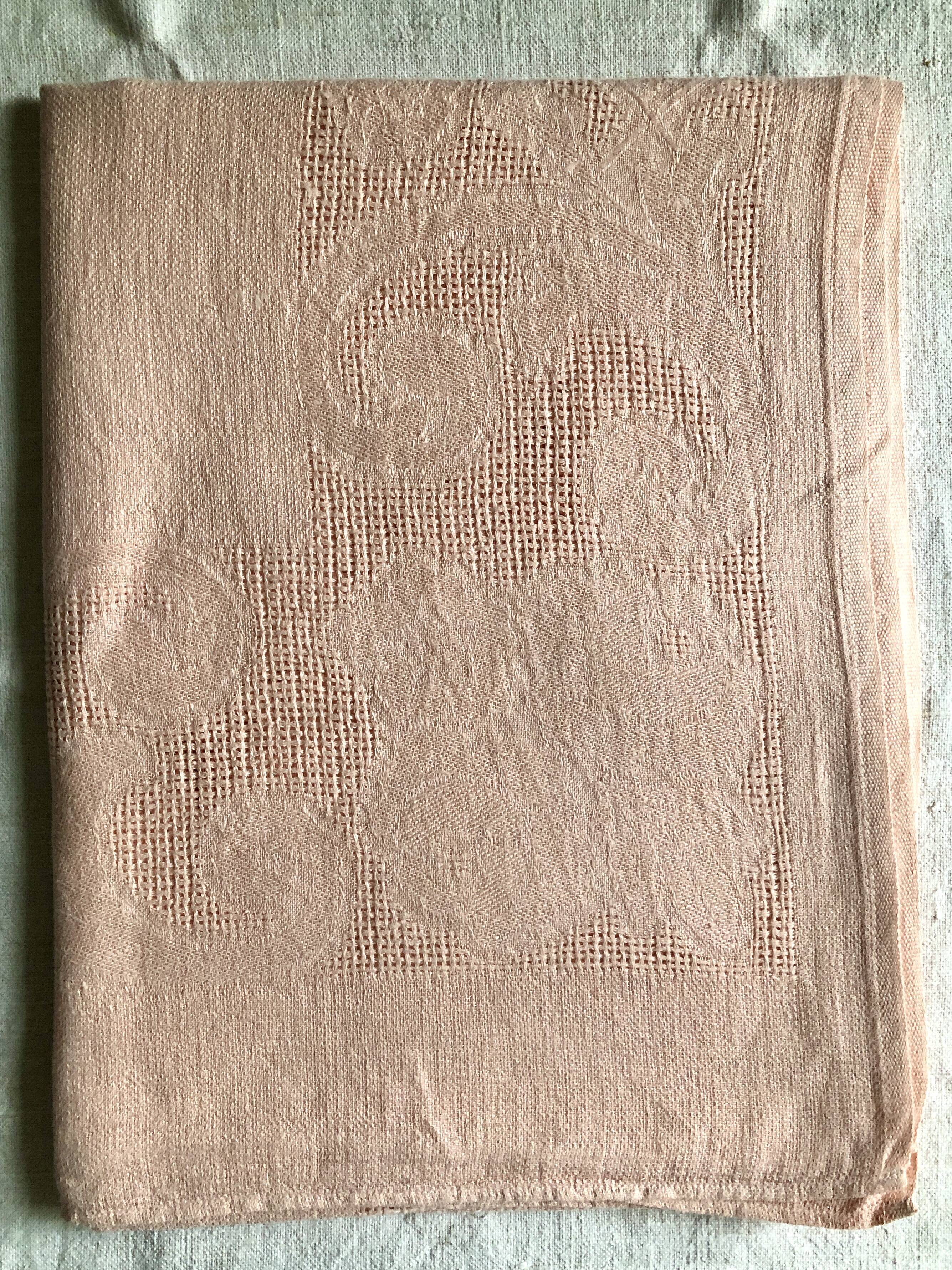 Antique tablecloth in pure linen tinted coral pink
