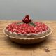 A trompe l’oeil strawberry pie dish