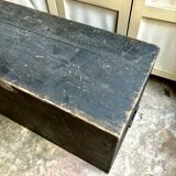 Trunk, black wooden chest and wallpaper