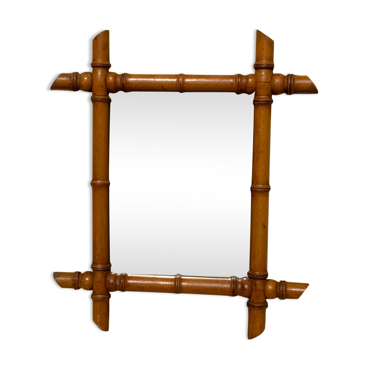 Vintage bamboo mirror in light wood bohemian decoration
