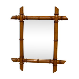 Vintage bamboo mirror in light wood bohemian decoration
