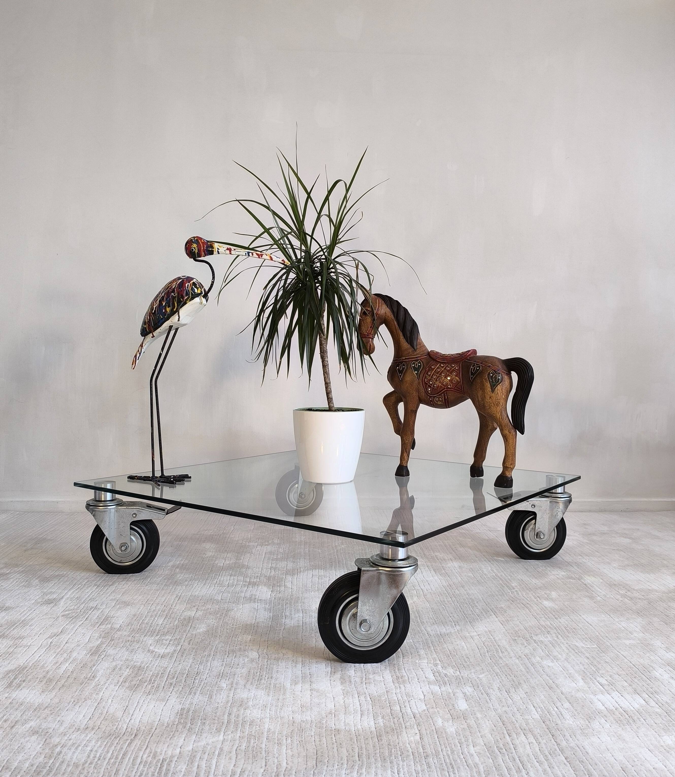 Beautiful designer glass coffee table on wheels