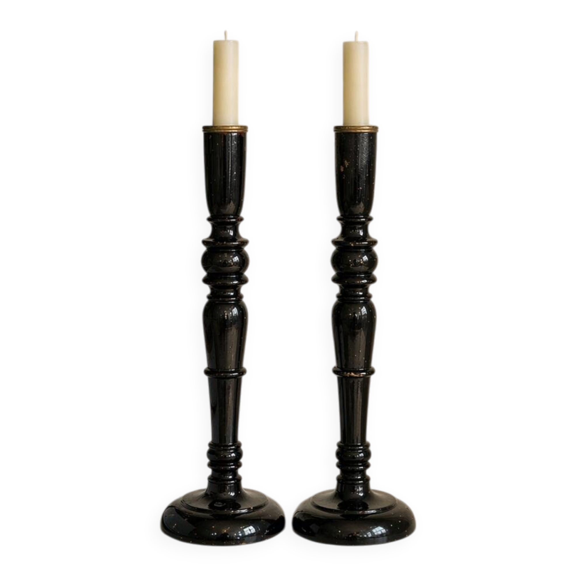Pair of antique ebonised wooden candlesticks from the 19th century.