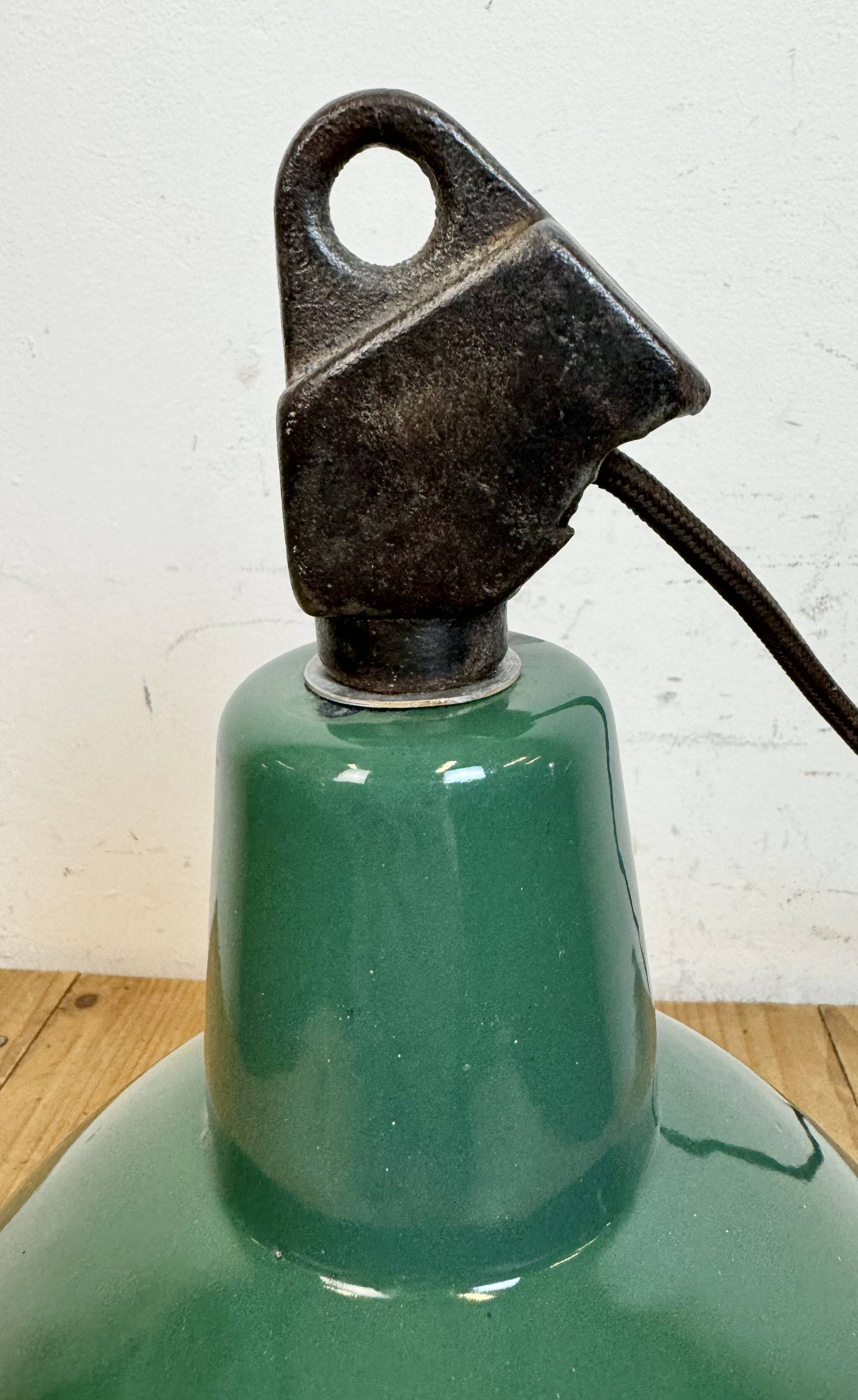 Industrial green enamel factory lamp with cast iron top, 1960s
