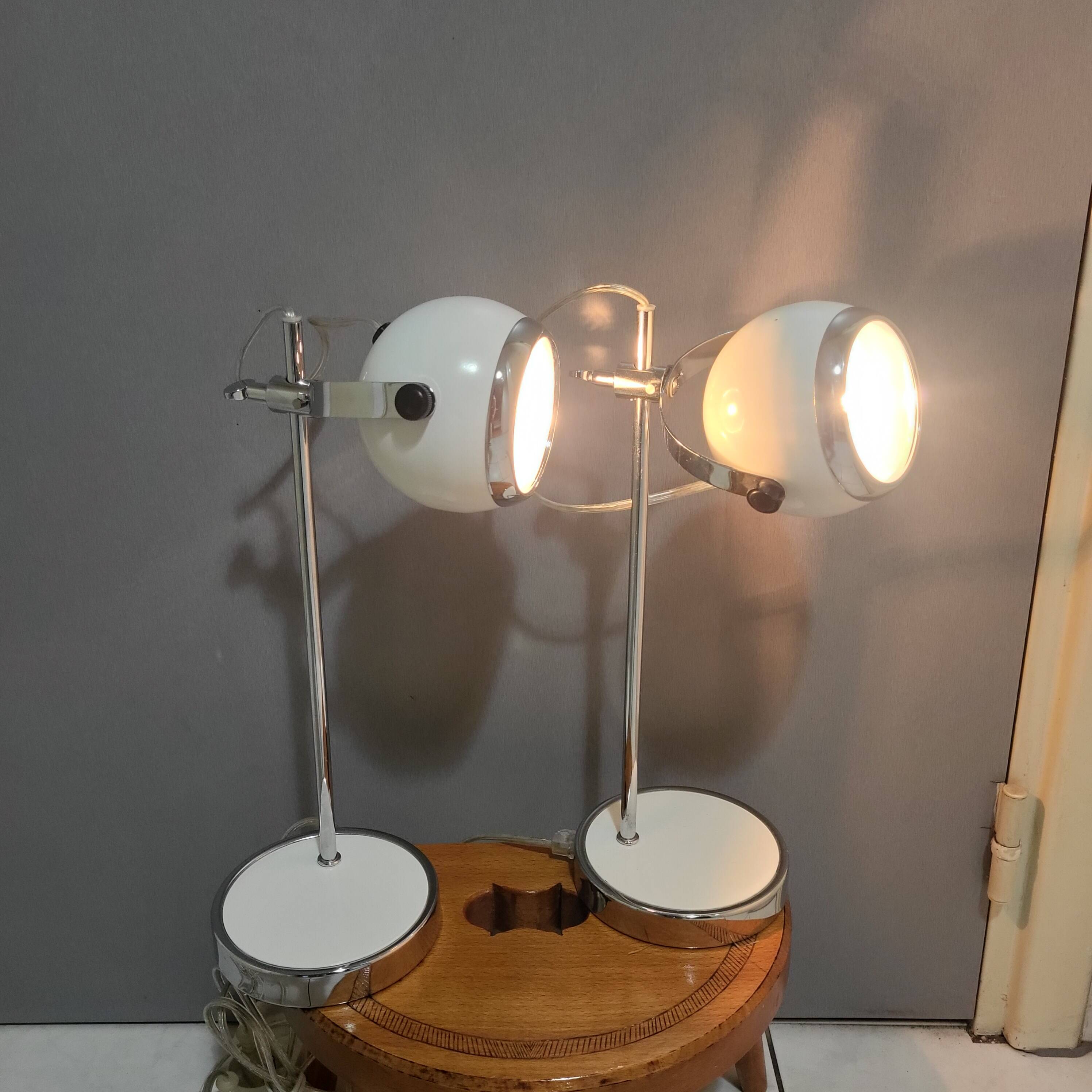 White and chrome metal eye ball lamps