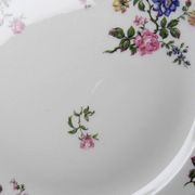 4 flat plates by Bernardaud, Limoges porcelain, floral decoration from the 1920s to 1950s.