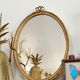 Golden oval mirror 32x44cm