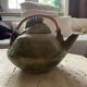 Handmade ceramic teapot with green fish and bamboo