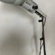 Industrial lamp on wrought iron tripod feet