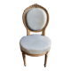 Medallion back chair in reclaimed wood and blue cotton, 18th century.