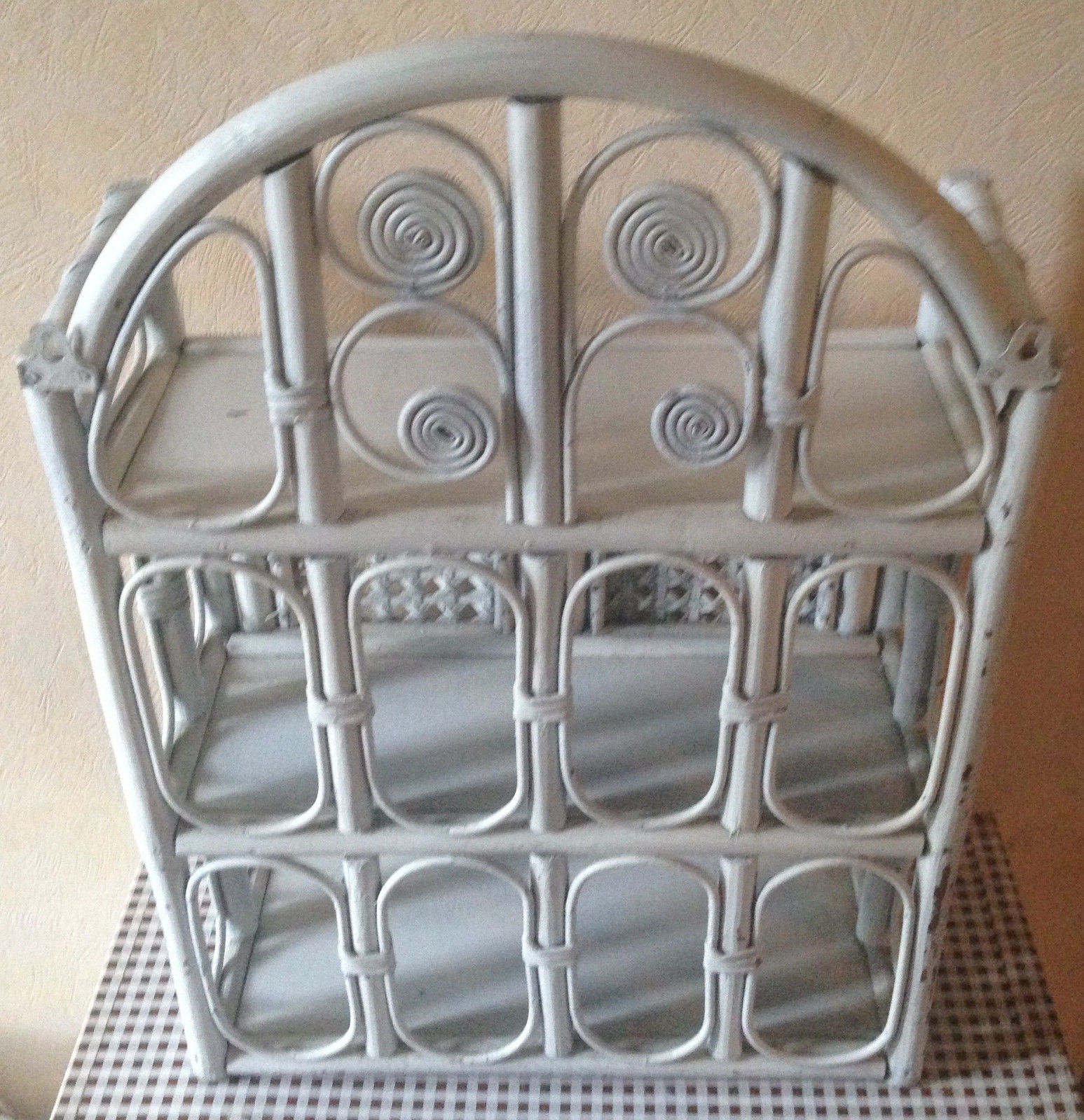 White rattan wall shelf