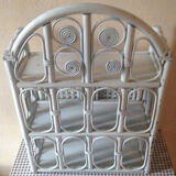 White rattan wall shelf