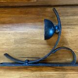 Two wrought iron wall lights, fabric cable.