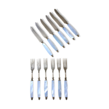 Old brass forks and knives and mother-of-pearl handle