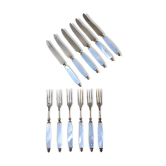 Old brass forks and knives and mother-of-pearl handle