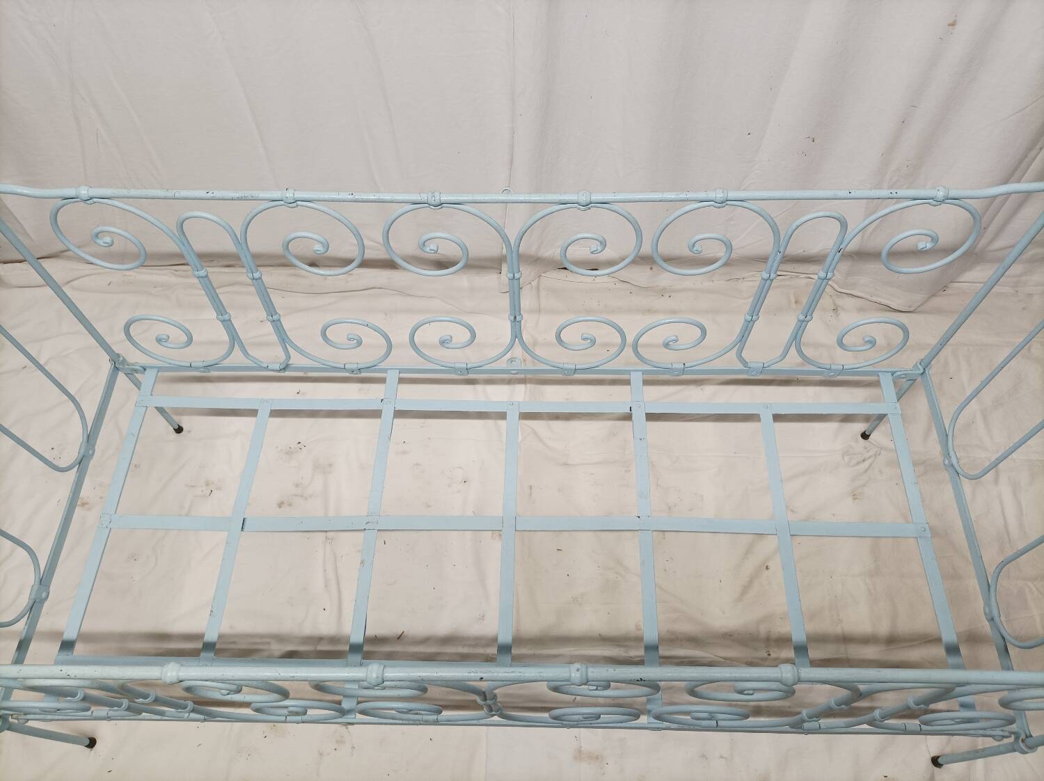 Old children's bed with metal bars