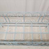Old children's bed with metal bars