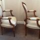 Pair of Louis XVI style medallion armchairs, late 19th / early 20th century.