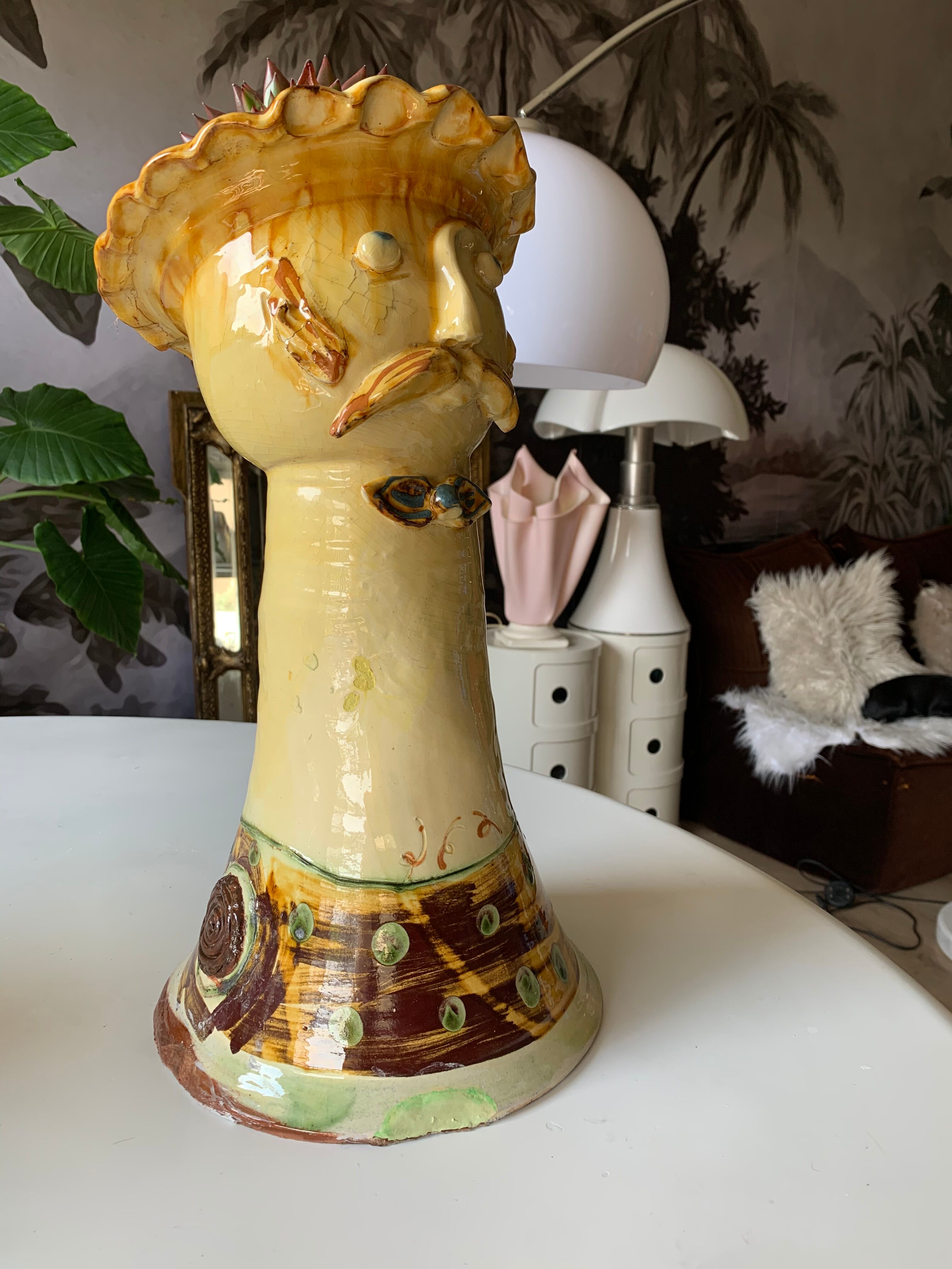 Terracotta plant holder head shape