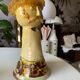 Terracotta plant holder head shape
