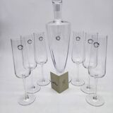 Carafe and 6 stemmed glasses made of Murano glass.