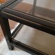Table basse noire ,or et double plateau verre fumé