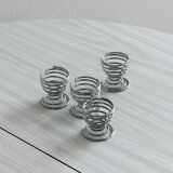 4 stainless steel egg cups.
