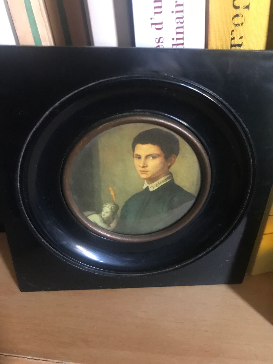 Two vintage round frame portraits