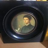 Two vintage round frame portraits