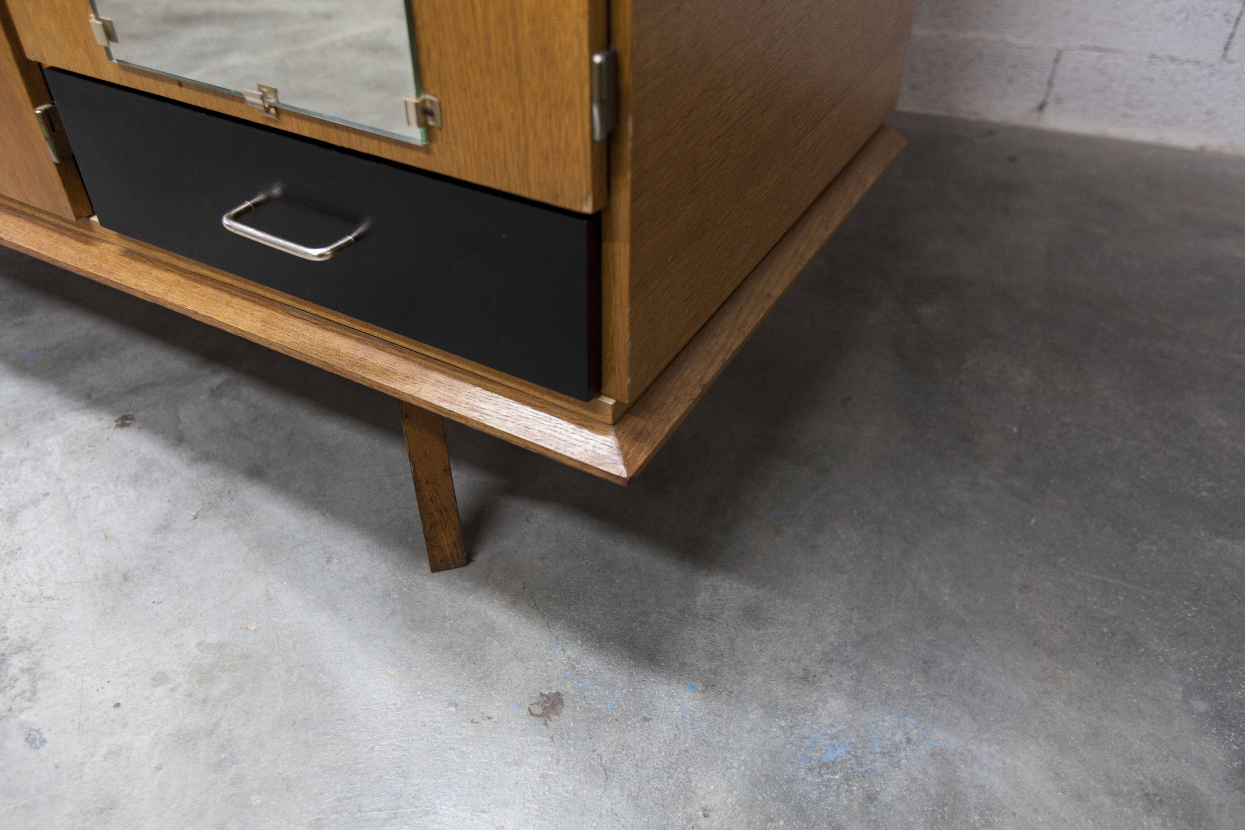 French wardrobe with tapered legs, 3 doors, 1 mirror (27*130), and 1 drawer.