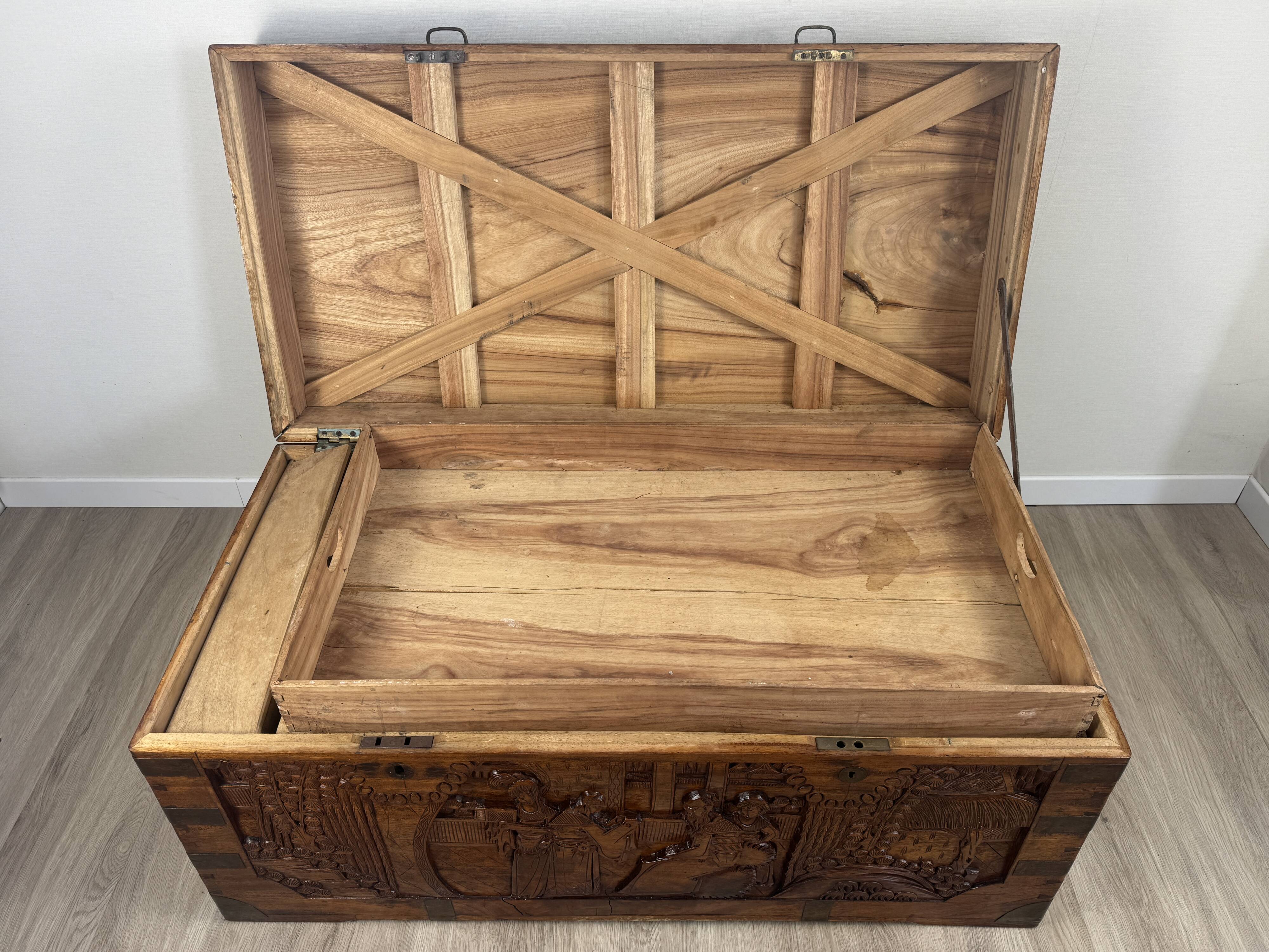 Chinese carved chest made of solid wood — life scenes in bas-relief