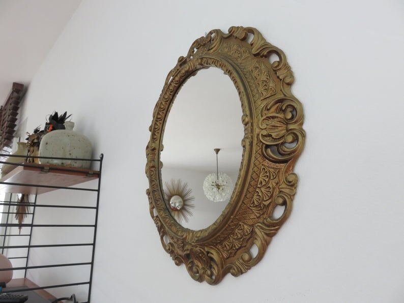 Golden baroque oval mirror, 60s-70s