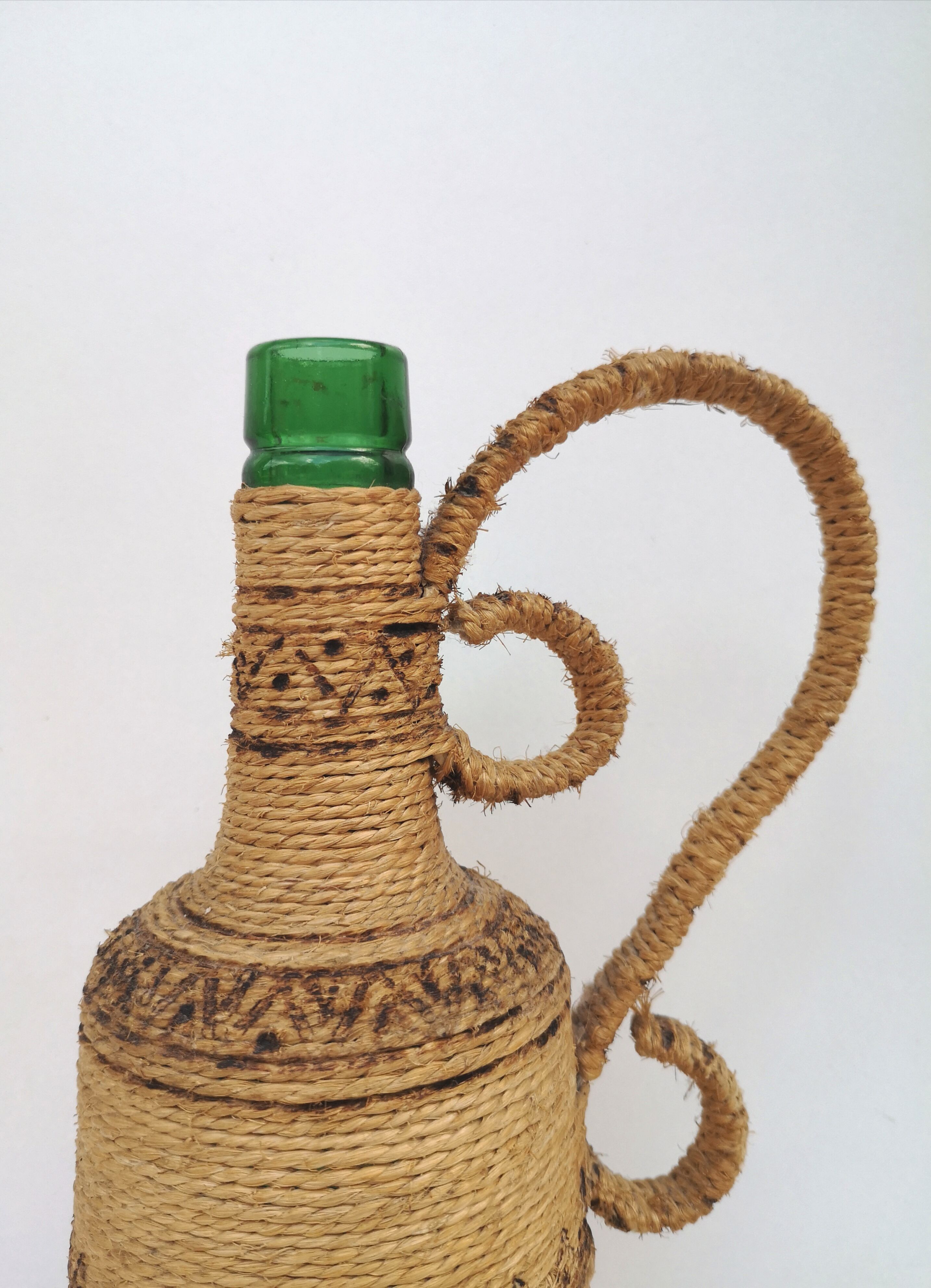 Vintage decorative rope bottle