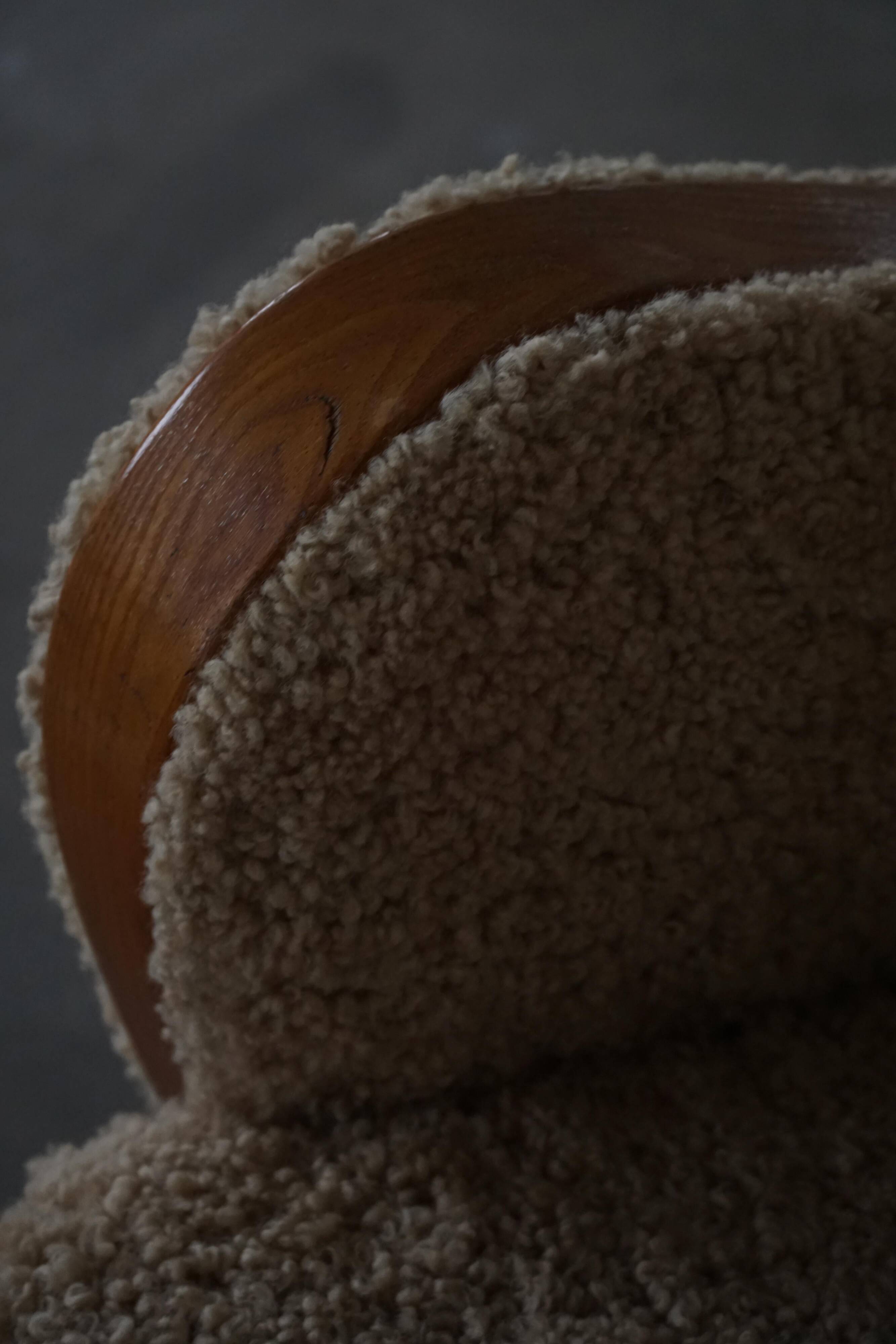 Pair of Danish Art Deco modern lounge chairs in sheepskin with lambswool and elm, 1940s.