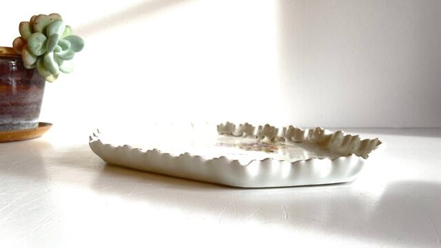 Old tray in floral pattern biscuit