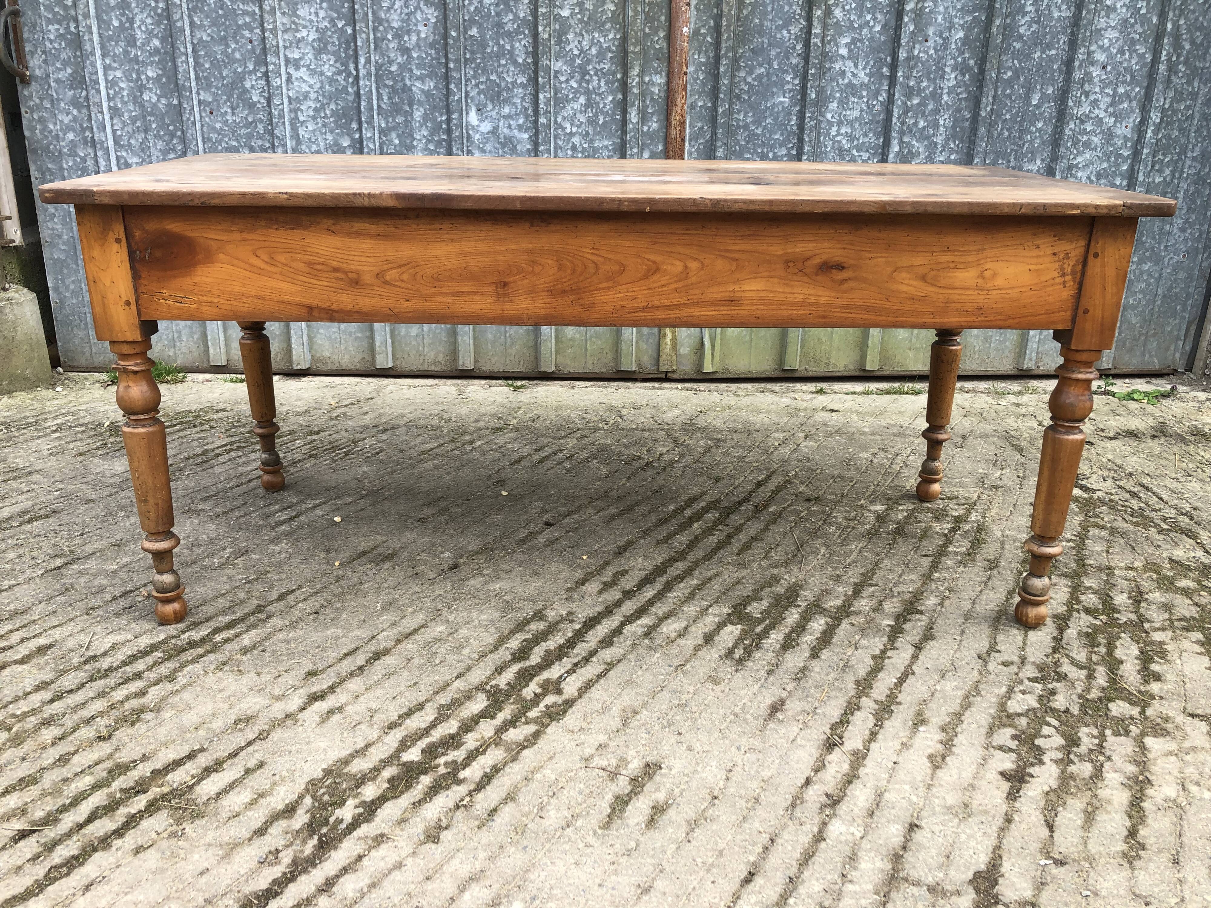 Antique cherry farmhouse table with 2 drawers and 1 pull-out
