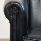 Black cowhide club chair in English style with a great luxurious design