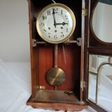 Wooden clock with beveled glass