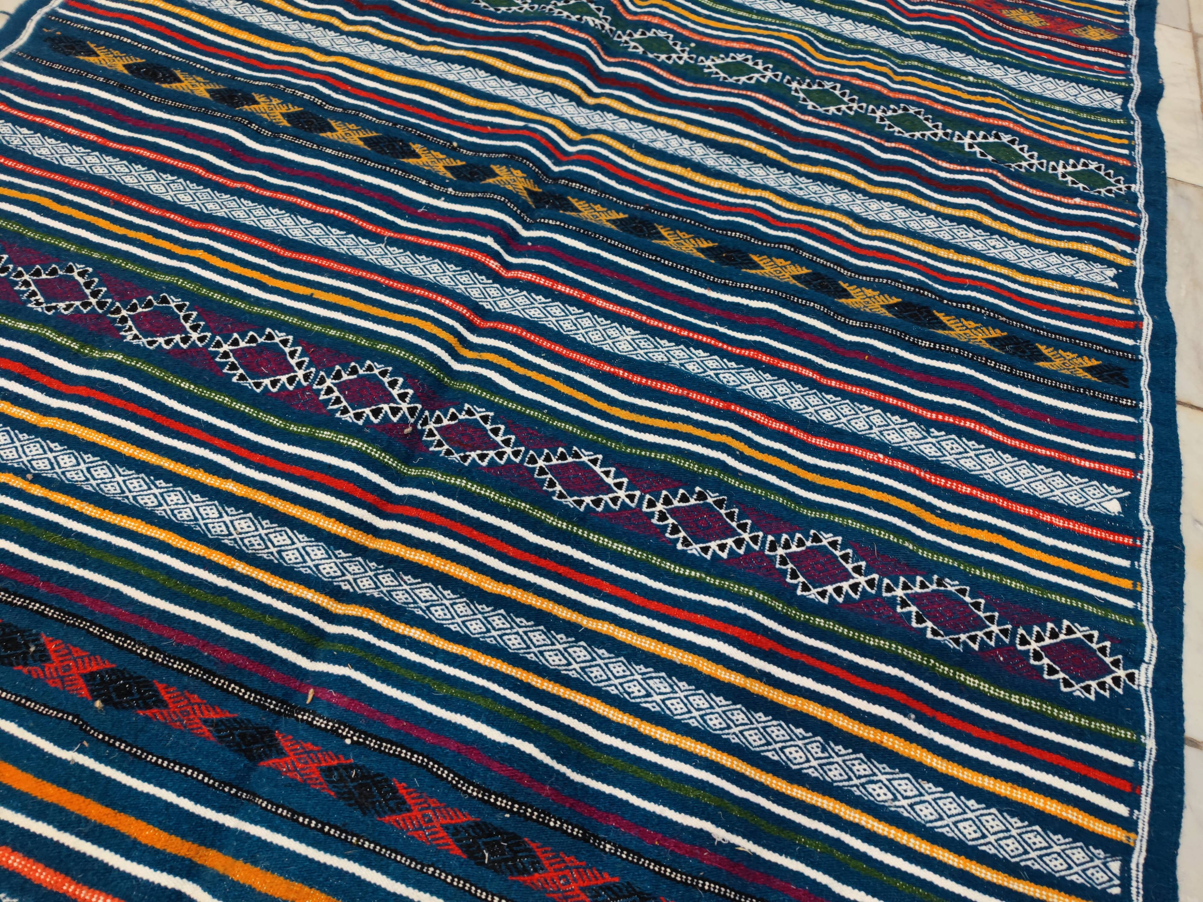 Handwoven blue kilim rug in natural wool