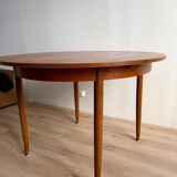 Vintage Scandinavian round table from the 50s and 60s in extendable teak with ra.