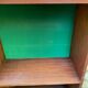 Vintage Scandinavian shelf from the 1960s in wood with green velvet.