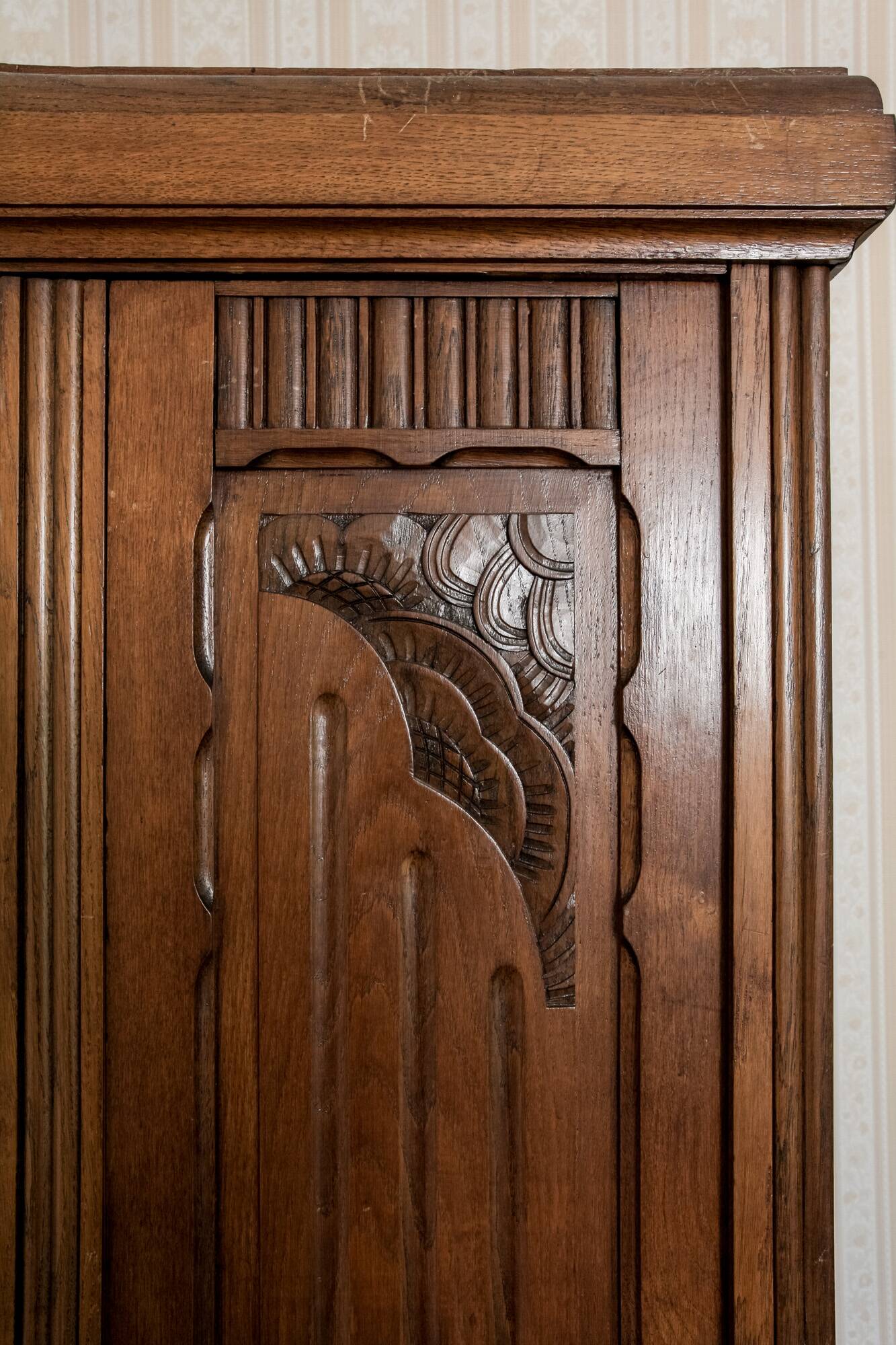 Old solid wood wardrobe with three vintage mirror doors