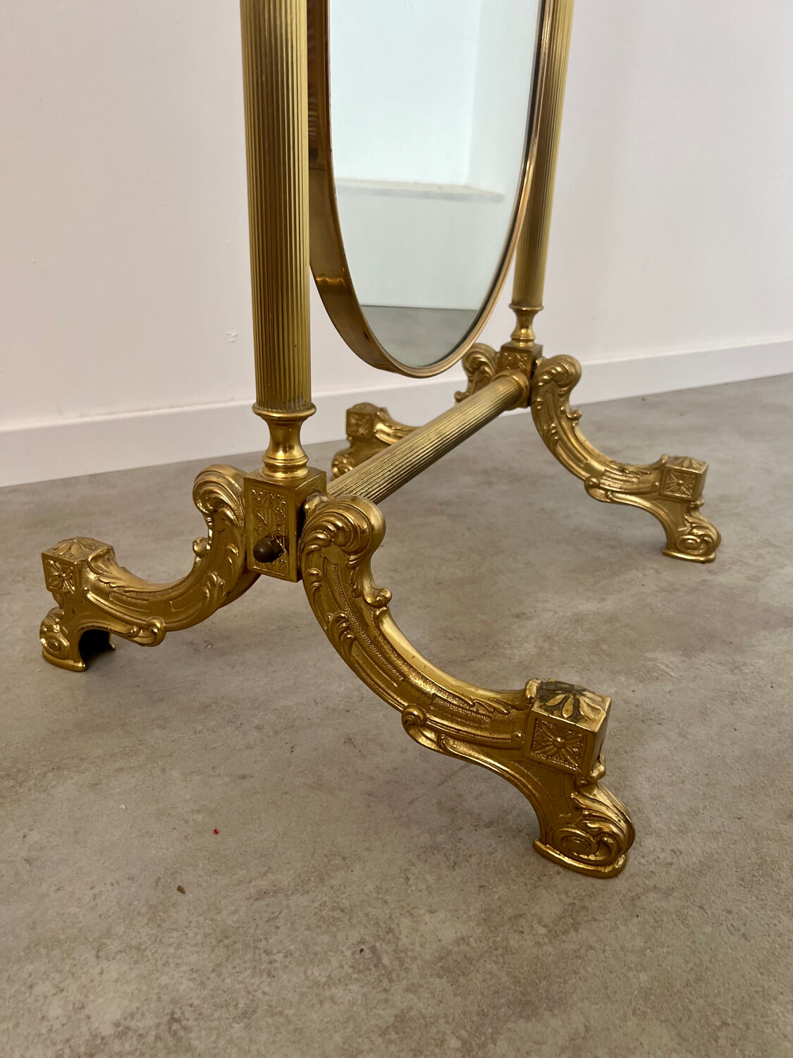 Old free-standing mirror in gilded brass in psychedelic neoclassical style Years 40 France