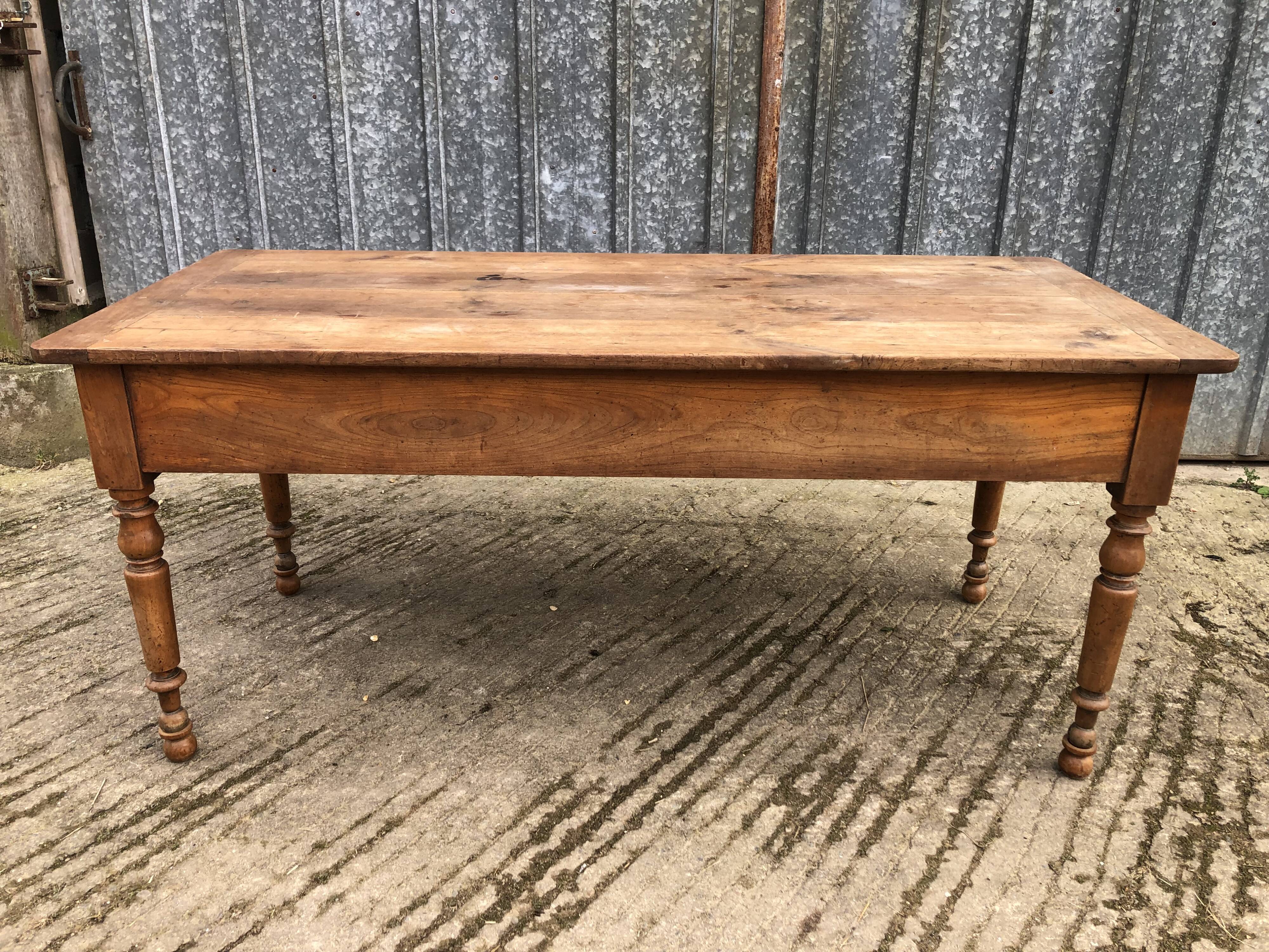 Antique cherry farmhouse table with 2 drawers and 1 pull-out