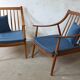 Pair of cozy teak armchairs with cushions