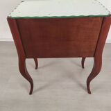 Glass art deco mirror beside table